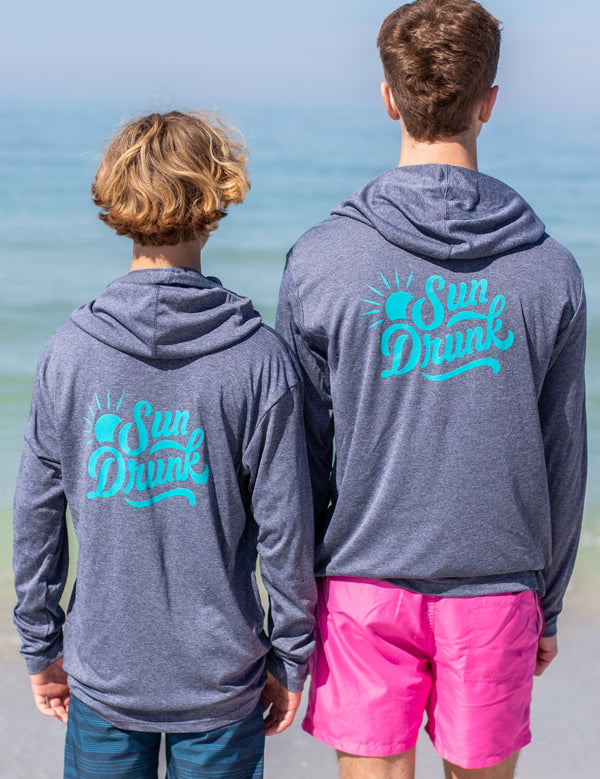 2-boys-wearing-sun-shirt-upf50-back-sun-drunk-logo.jpg