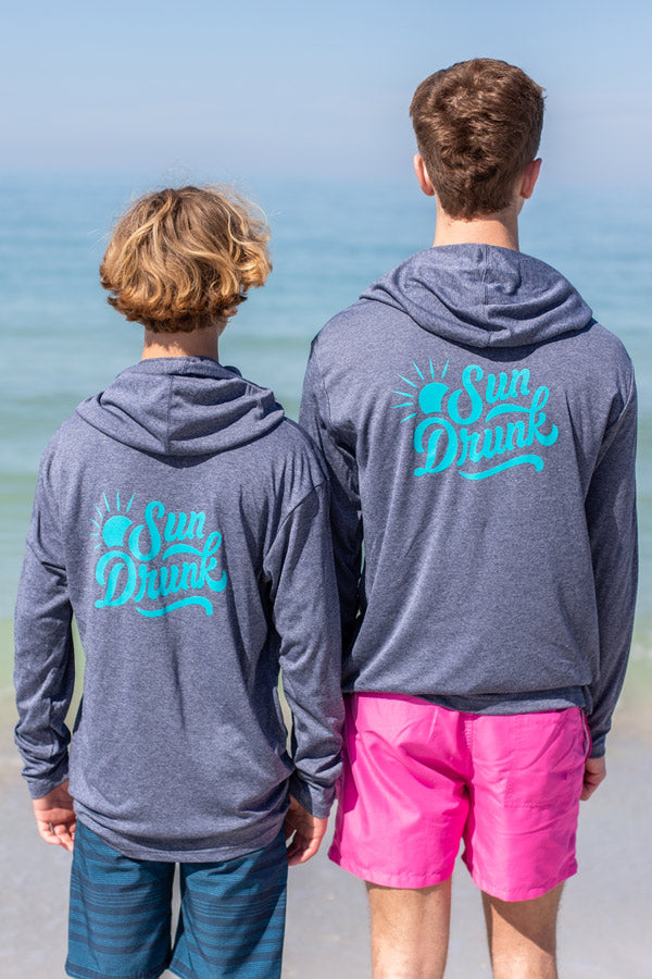 2-boys-wearing-sun-shirt-upf50-back-sun-drunk-logo.jpg