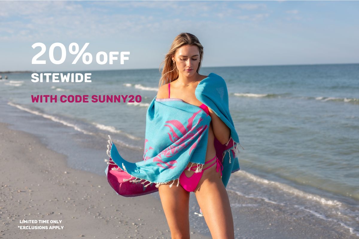 Woman-turkish-towel-on-the-beach-promotion.jpg