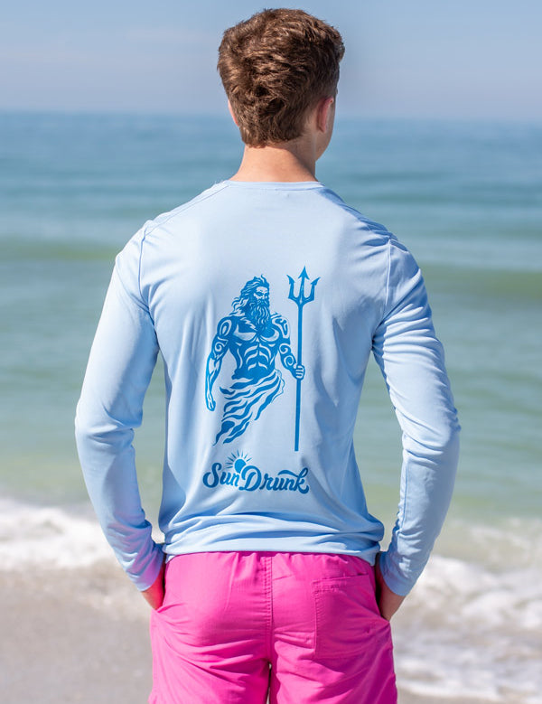 man-wearing-upf-sun-shirt-light-blue-back-merman-design.jpg